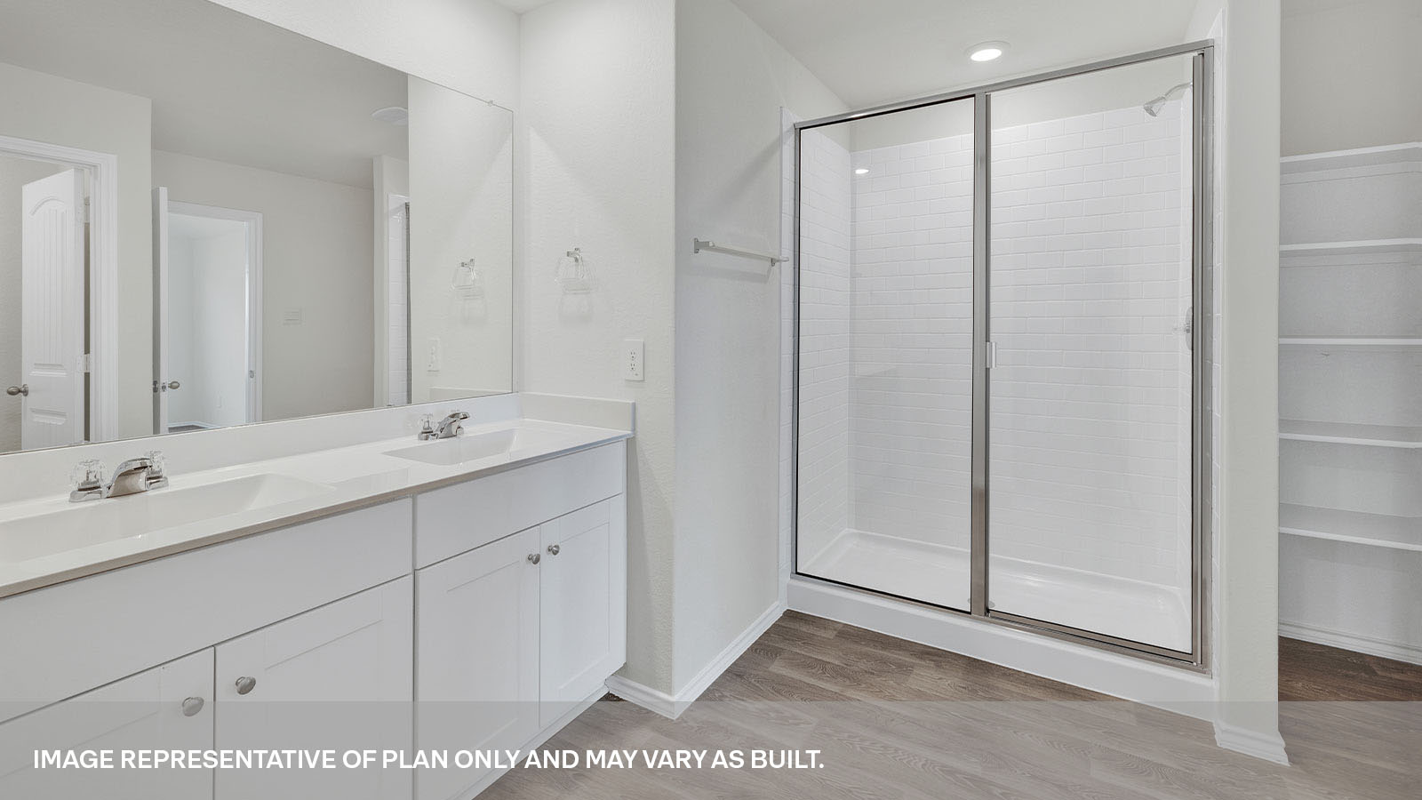 Main bathroom with a double sink and walk-in shower.