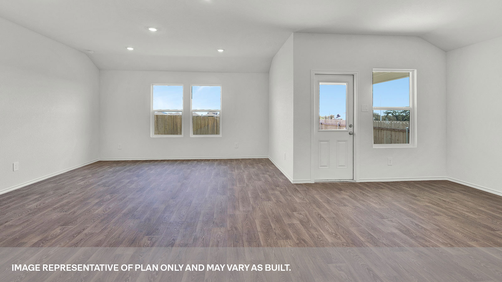 Dining room and living room with vinyl flooring, 3 windows, and a half lite exterior door.