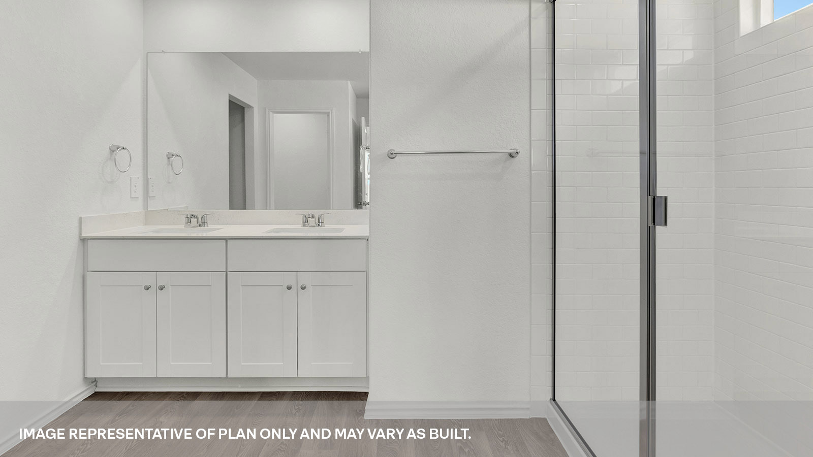 Main bathroom with a double sink and walk-in shower.