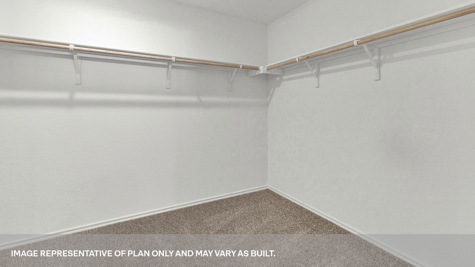 Walk-in closet with wooden shelves.