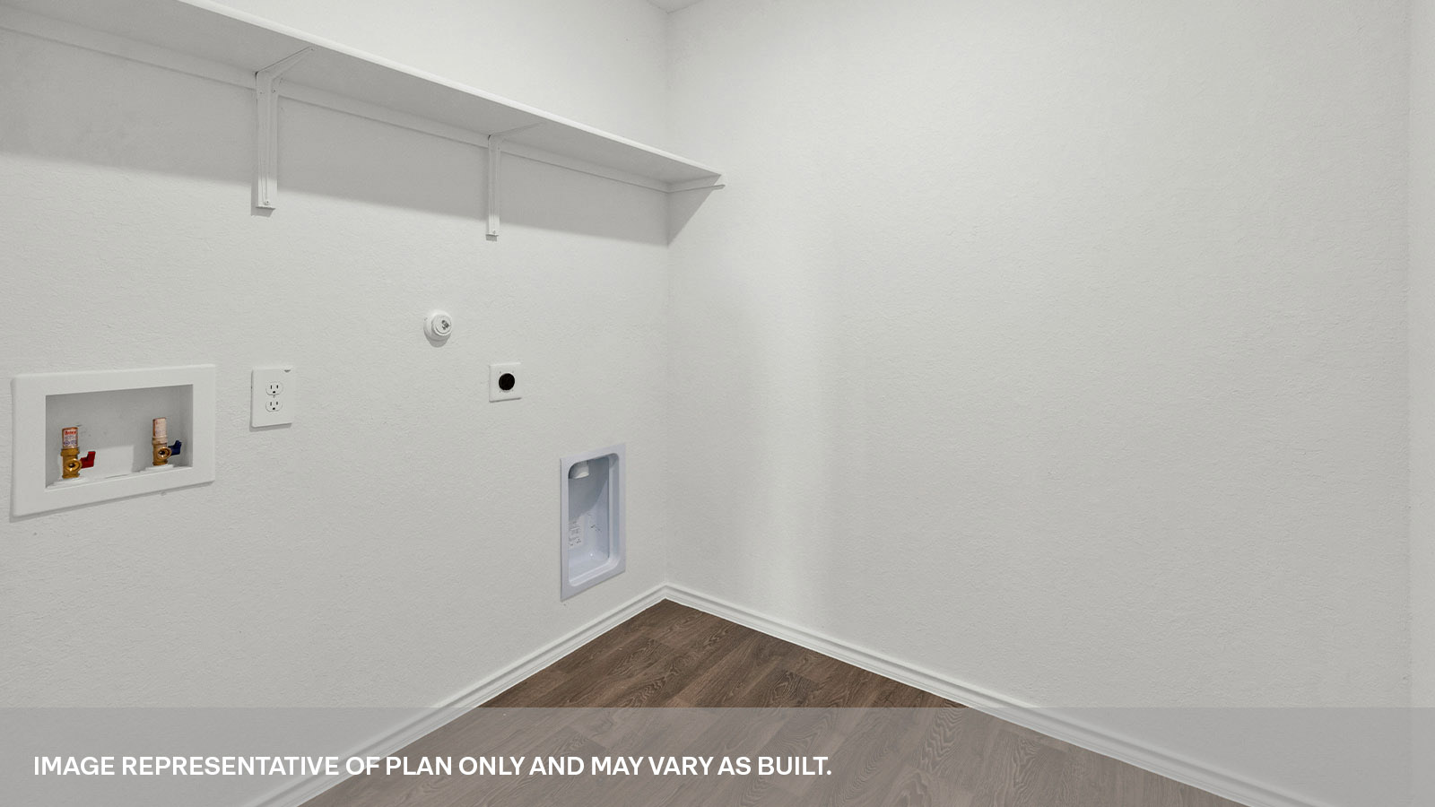 Laundry room with a wood shelf and washer/dryer connections.