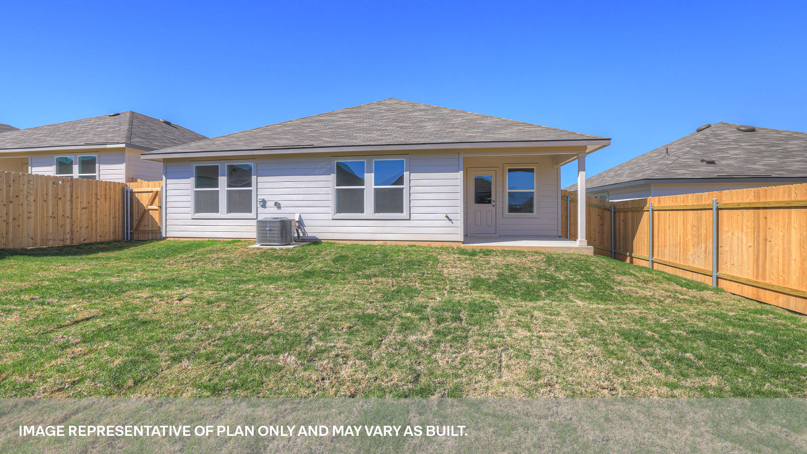 Covered back patio with privacy fence.