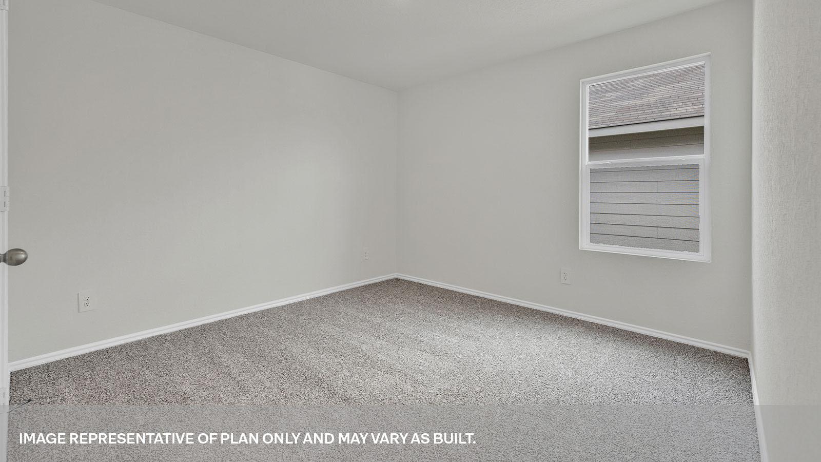 Second bedroom with carpeting and a window showing the side yard.