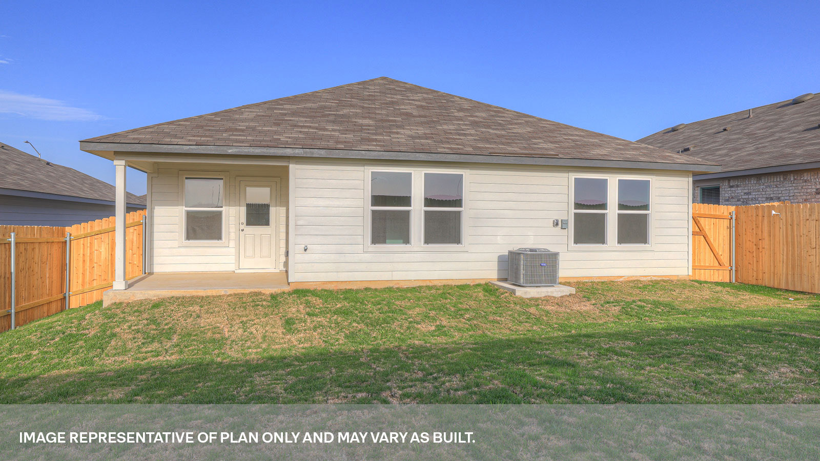 Covered back patio with privacy fence.