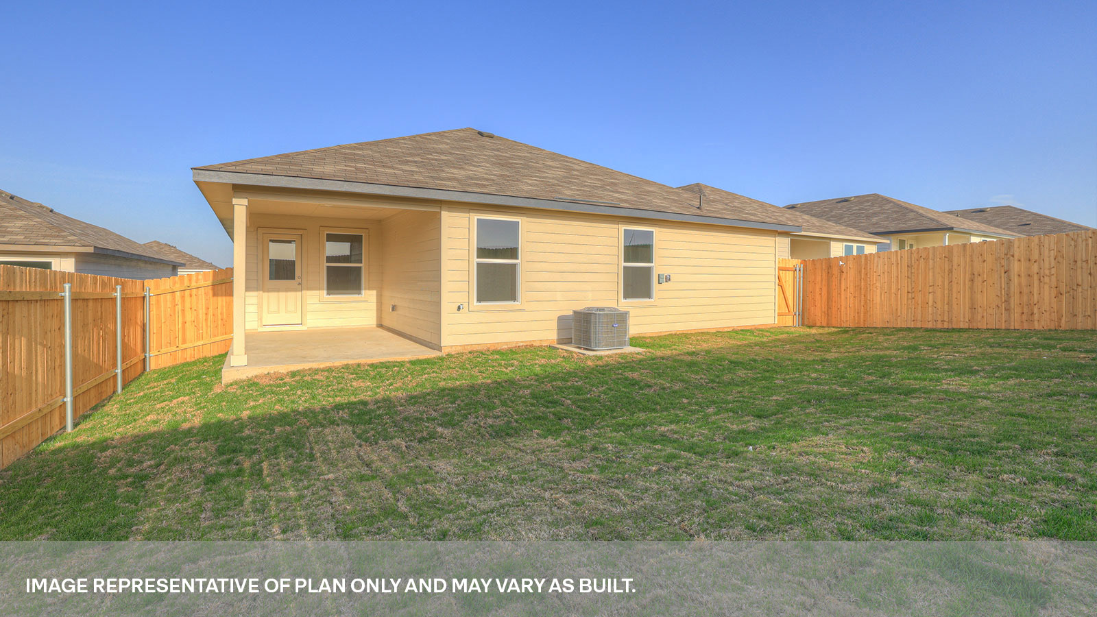 Covered back patio with privacy fence.