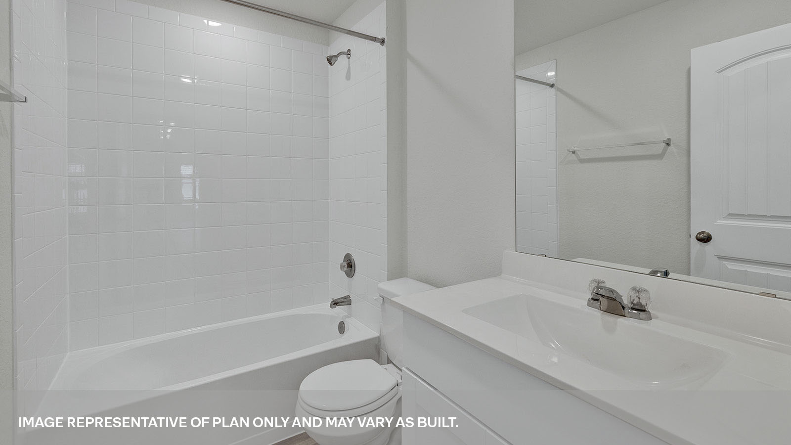 Third Bathroom with a tile surround shower/tub combo, single sink,and white cabinets.