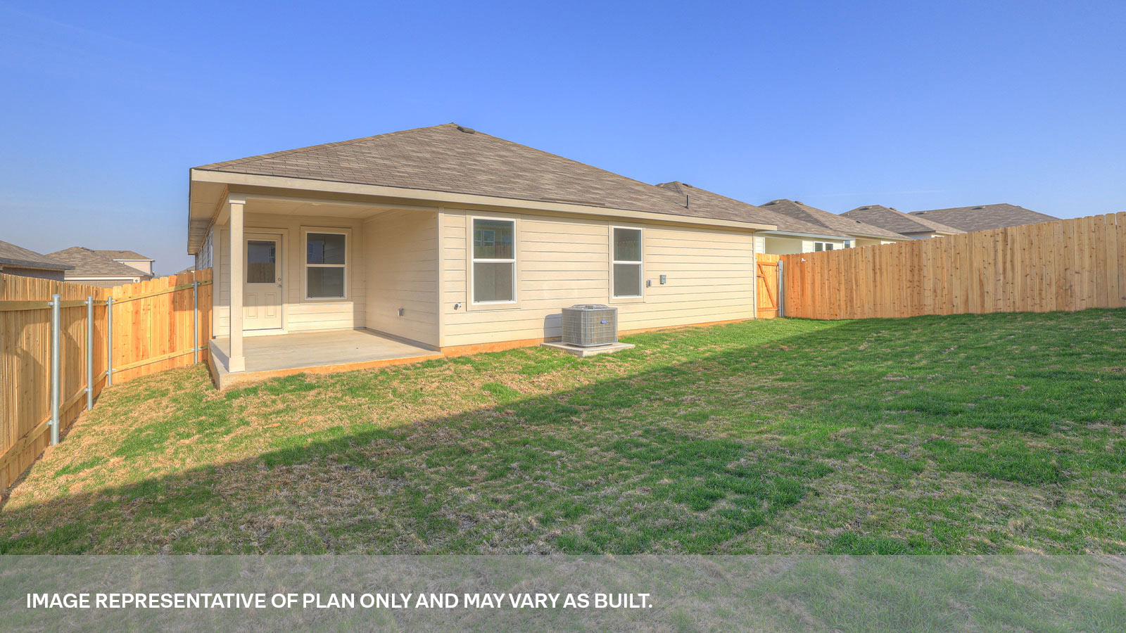 Covered back patio with privacy fence.