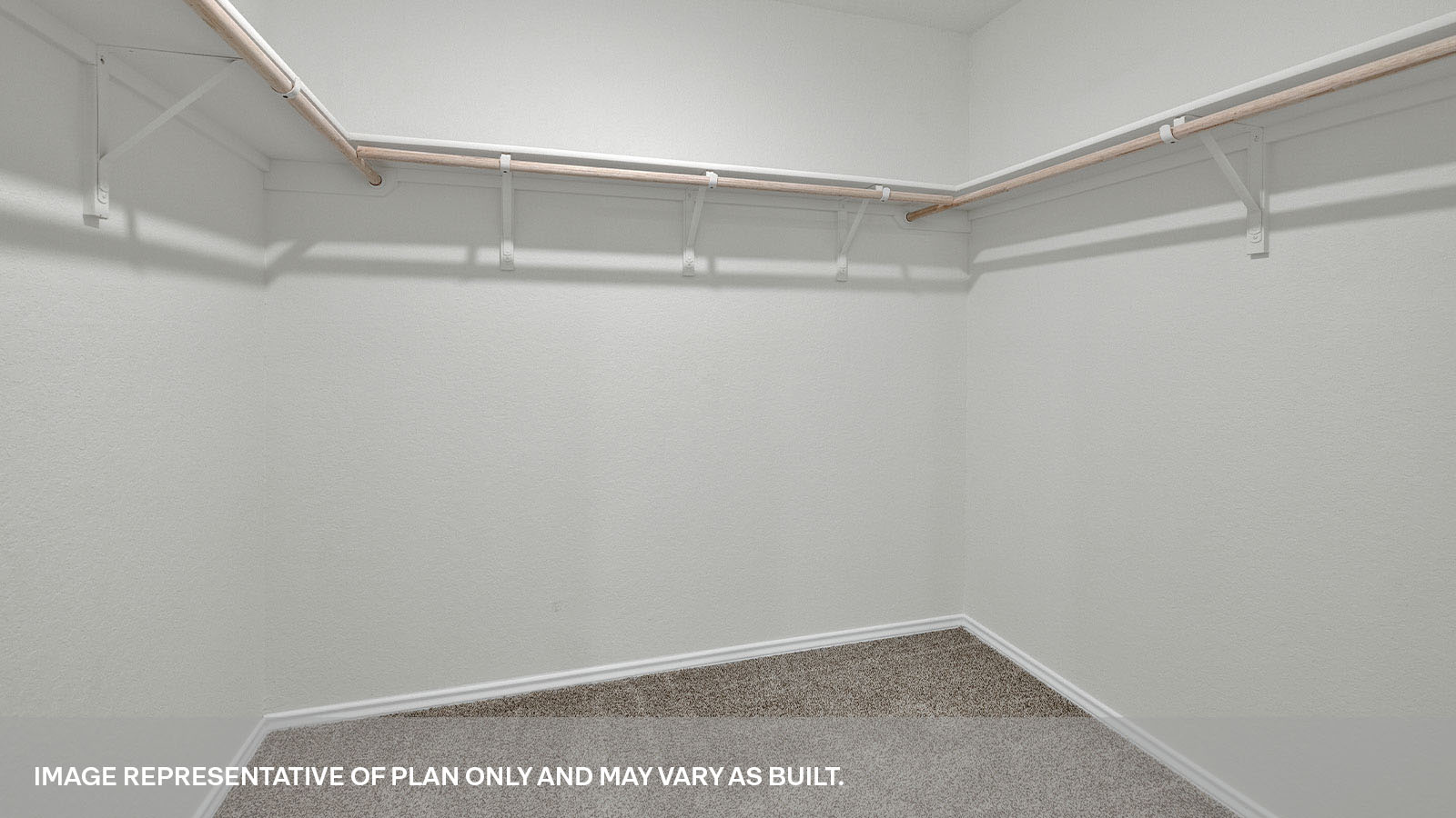 Walk-in closet with wooden shelves.