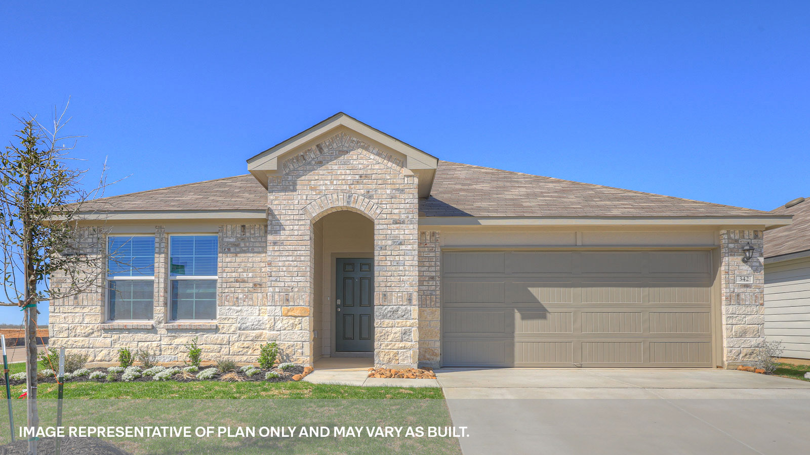 Arroyo Ranch Lakeway B elevation with a brick and stone exterior.