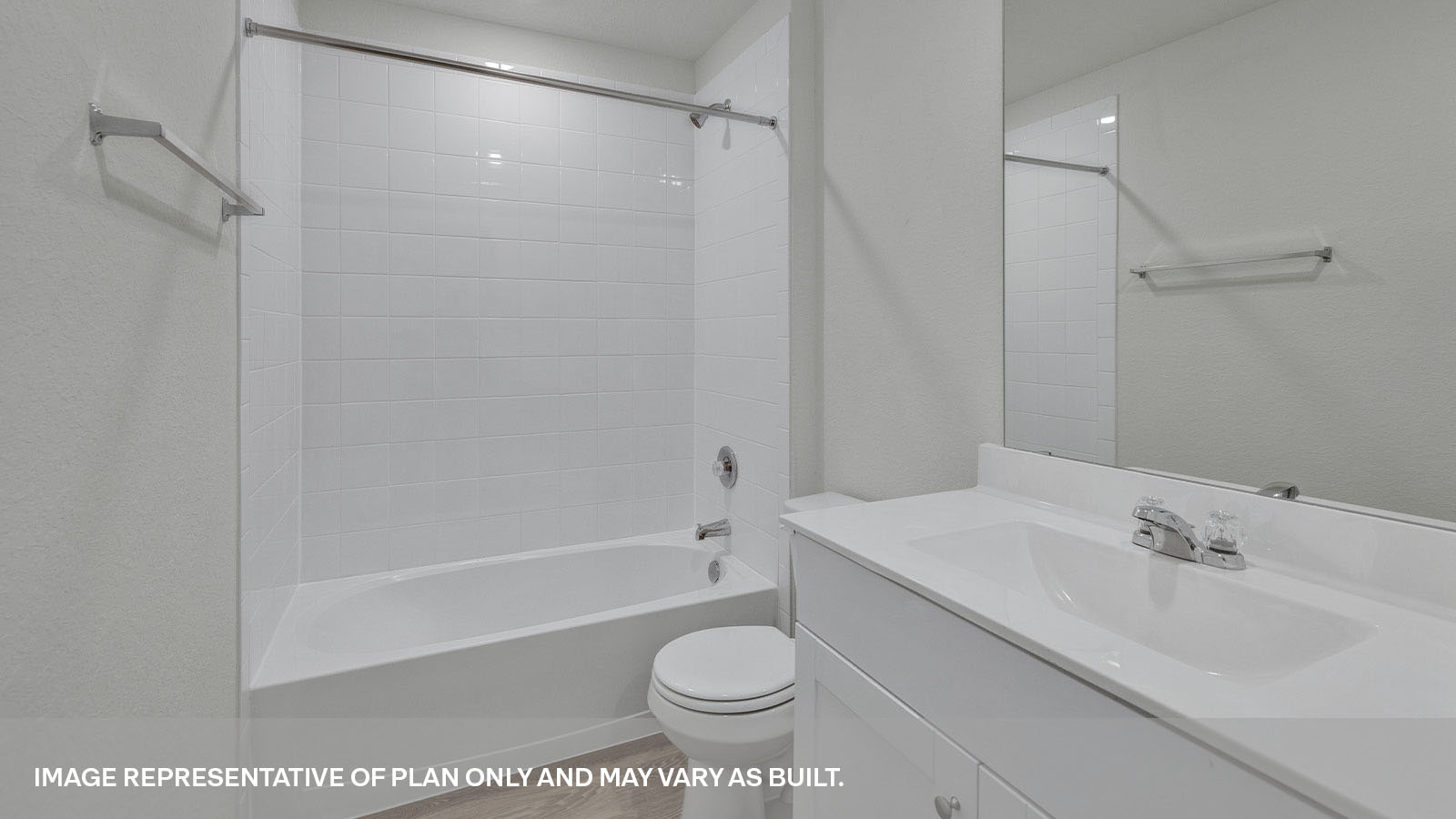Bathroom with a tile surround shower/tub combo, single sink, under sink white cabinets.