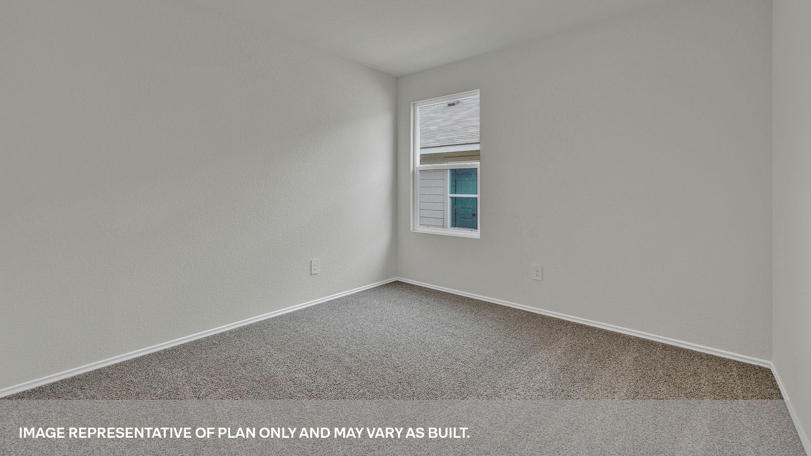 Second bedroom with carpeting and a window showing the side yard.