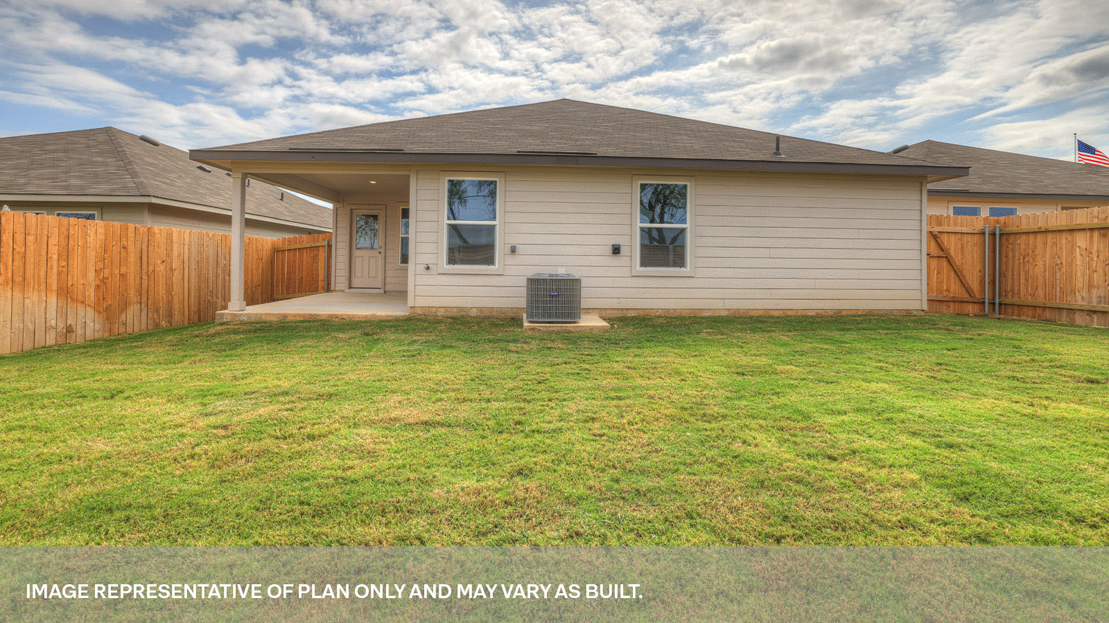 Covered back patio with privacy fence.
