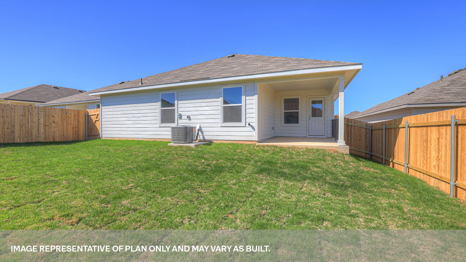 Covered back patio with privacy fence.