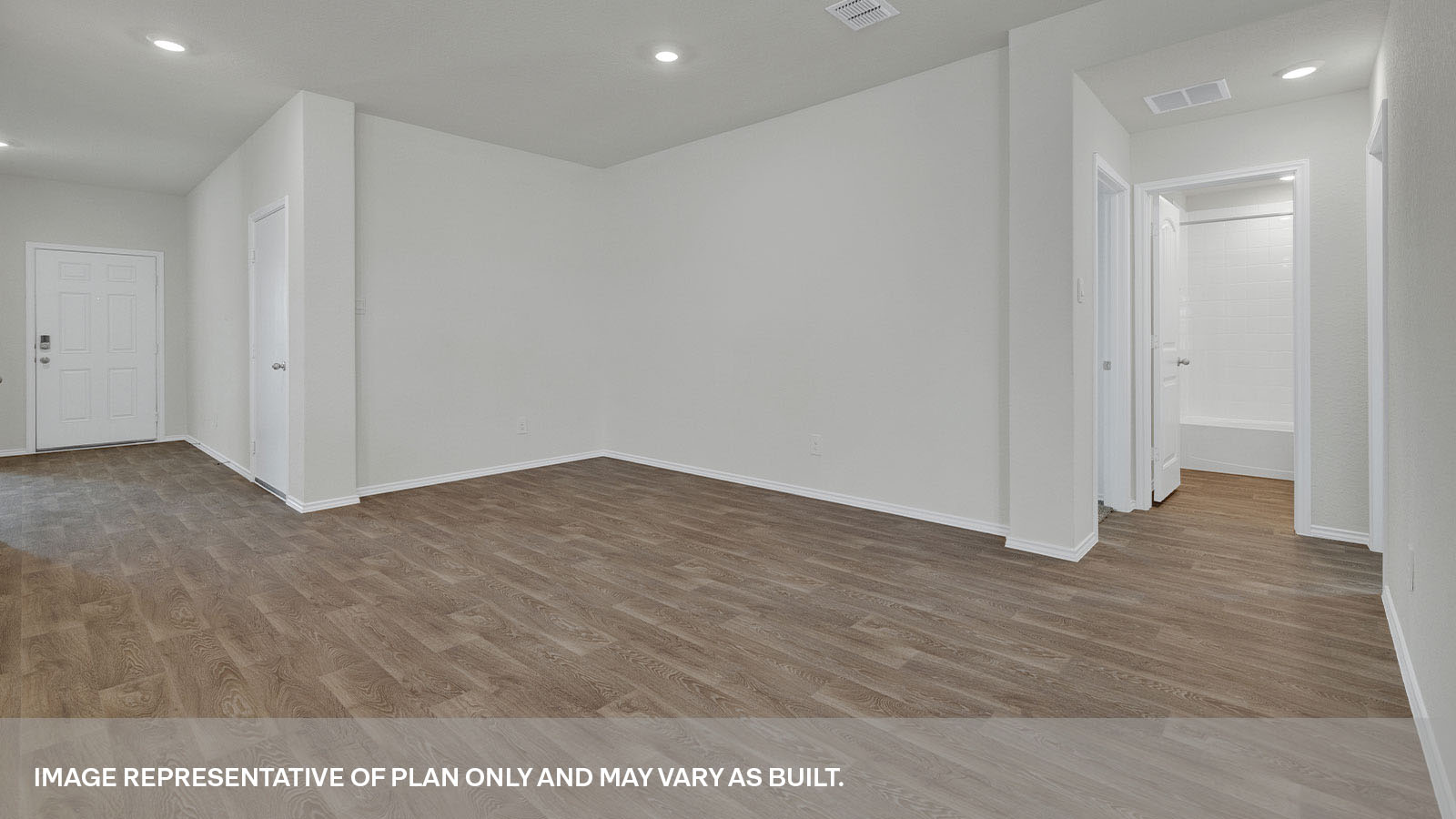 Dining room with vinyl flooring and entry hallway.
