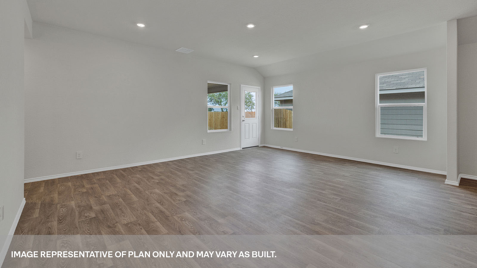 Living room with vinyl flooring opening to the main bedroom.