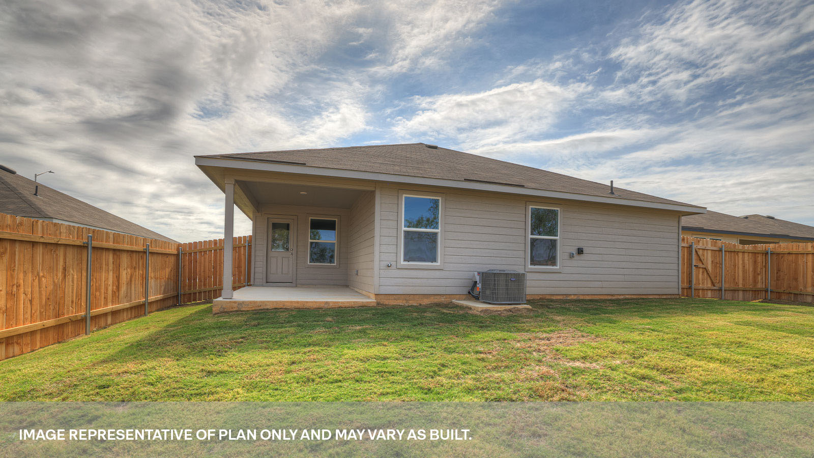 Covered back patio with privacy fence.