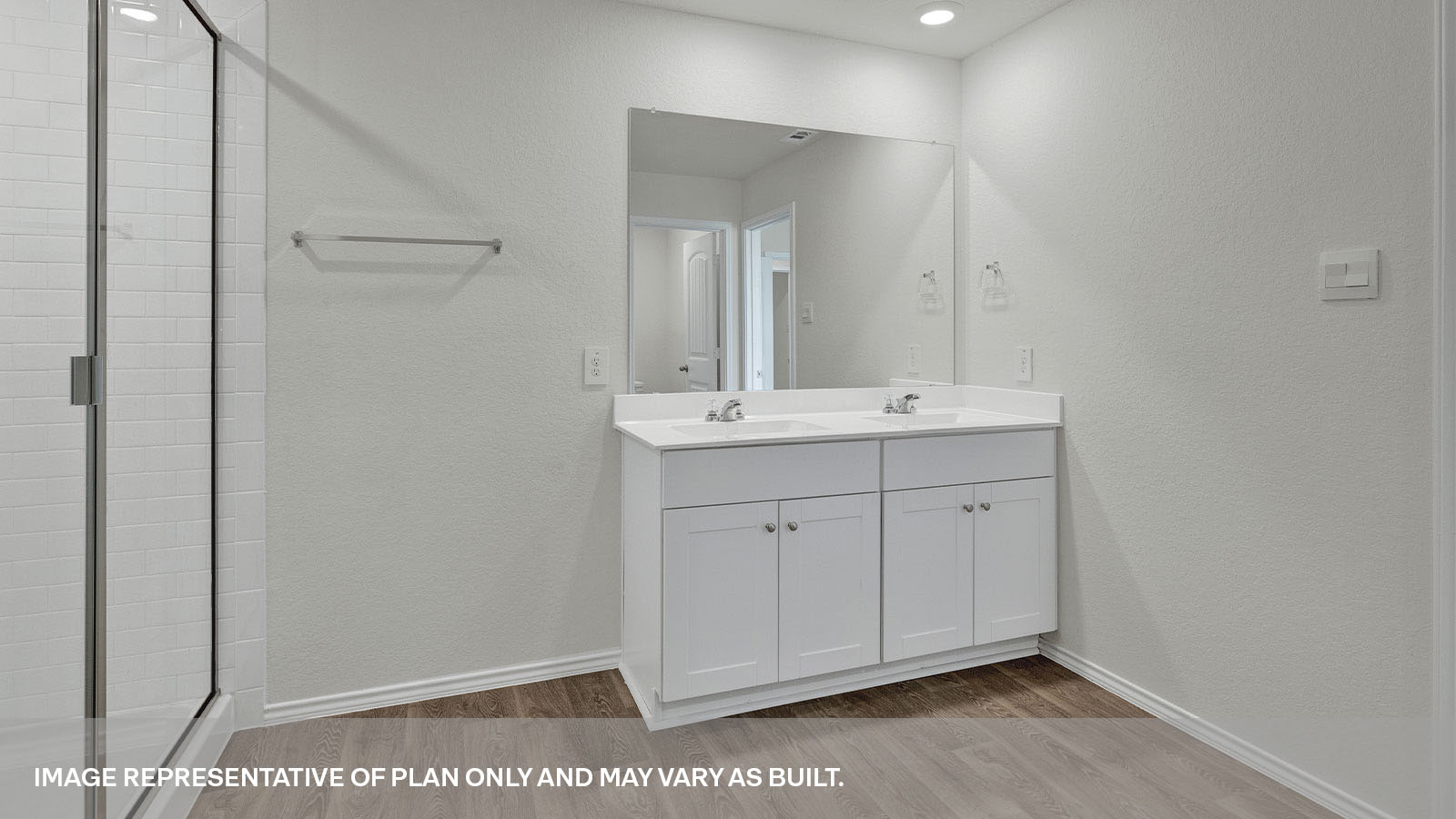 Main bathroom with a walk-in shower and a double sink.
