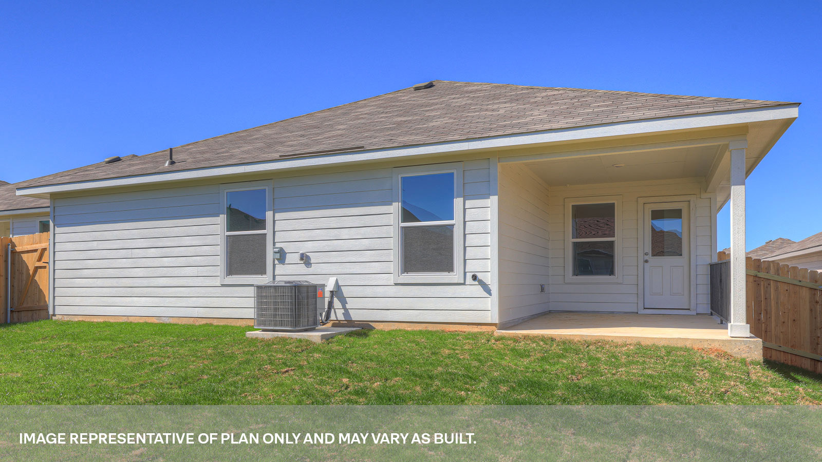 Covered back patio with privacy fence.