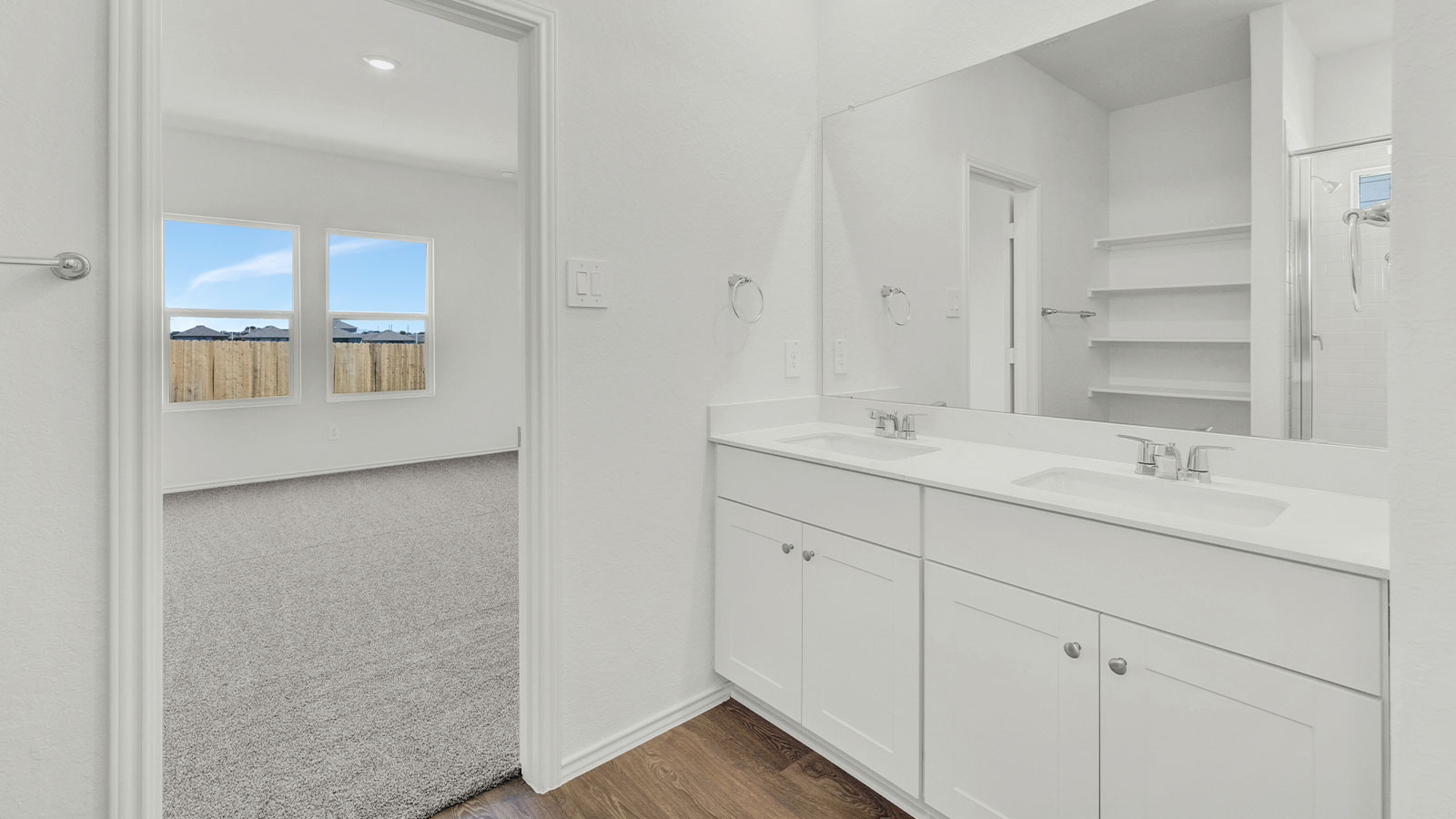 Main bathroom with double sink vanity.