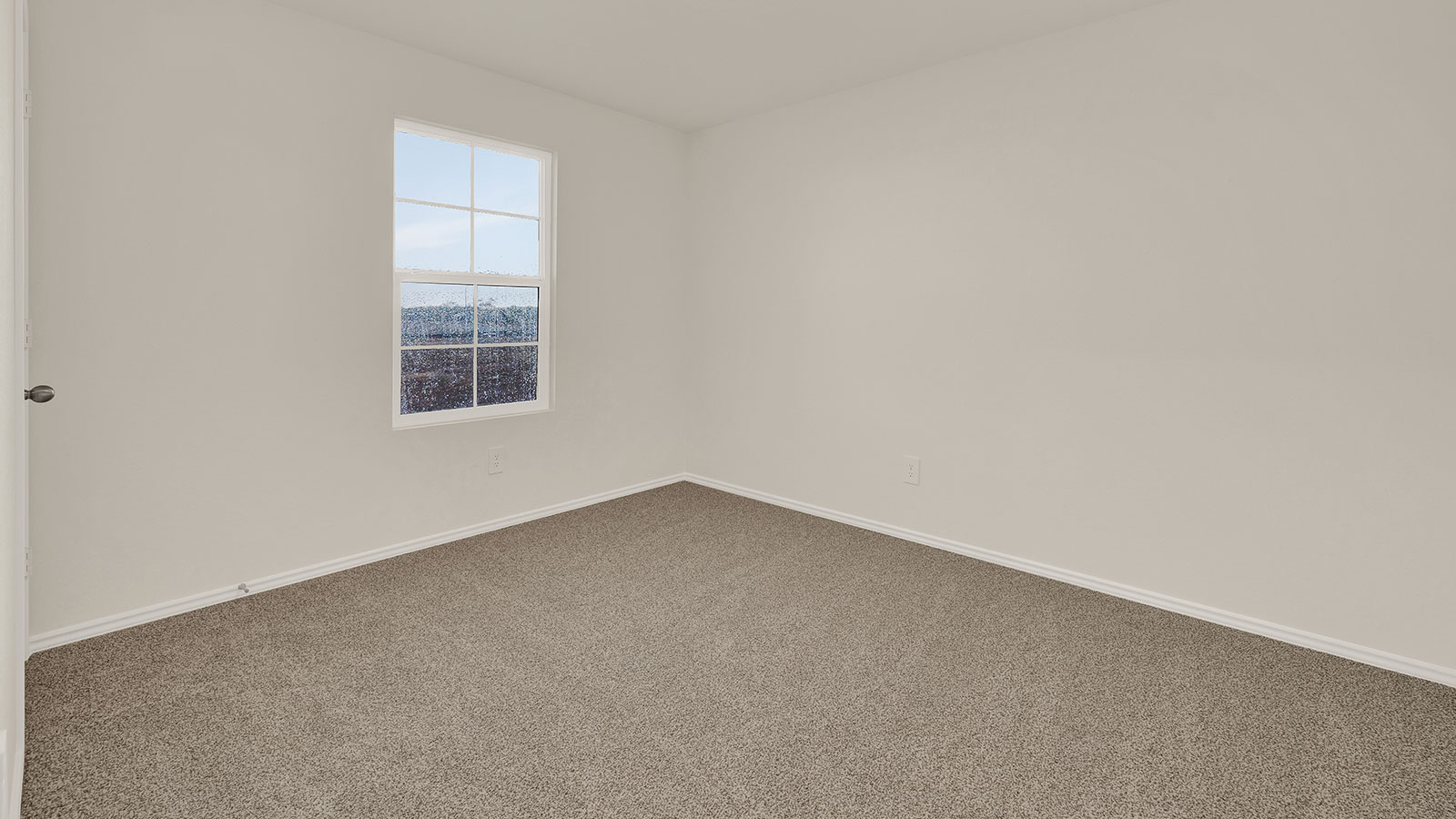 Secondary bedroom with carpeting and one window.