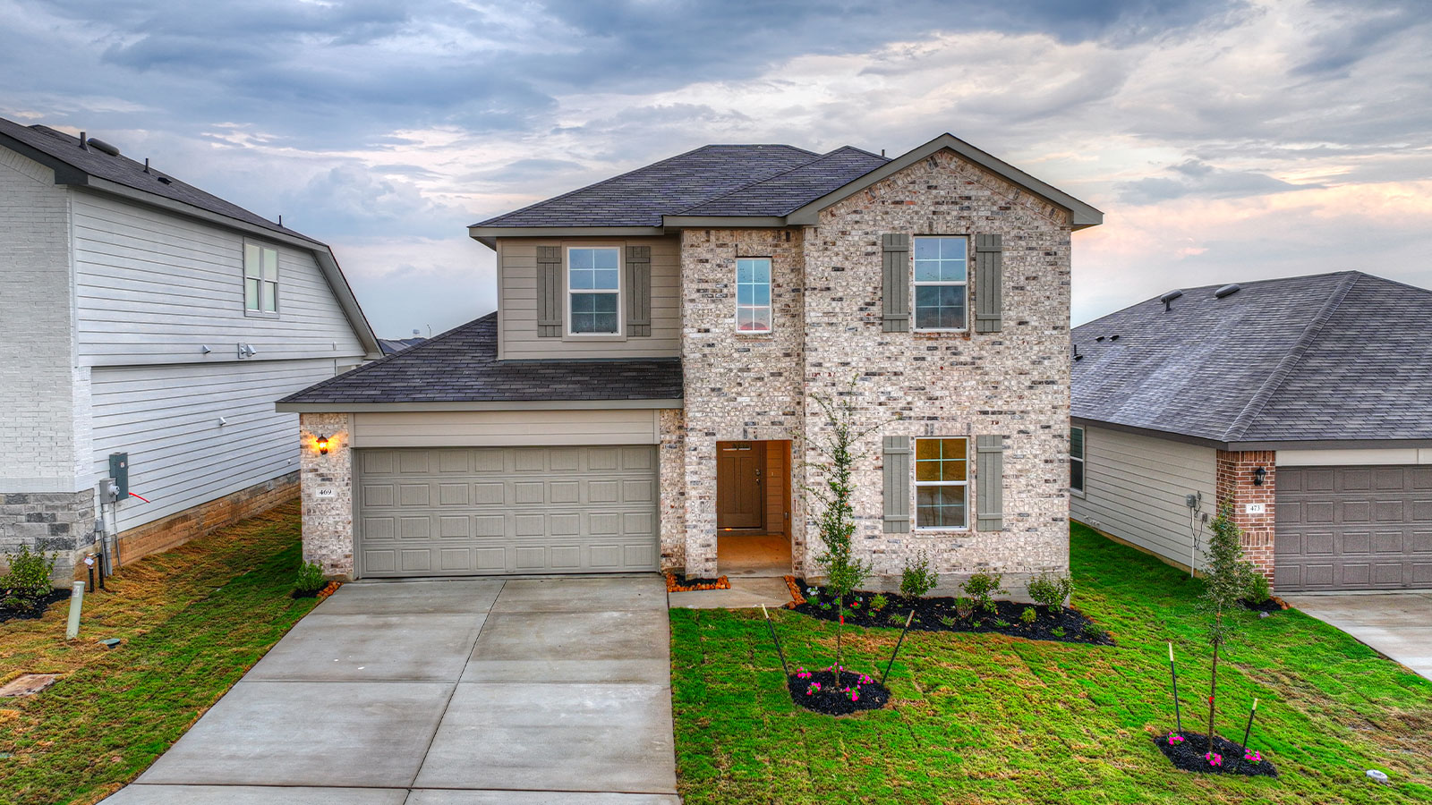 Two-story Naples with masonry exteriors and a 2 car garage.