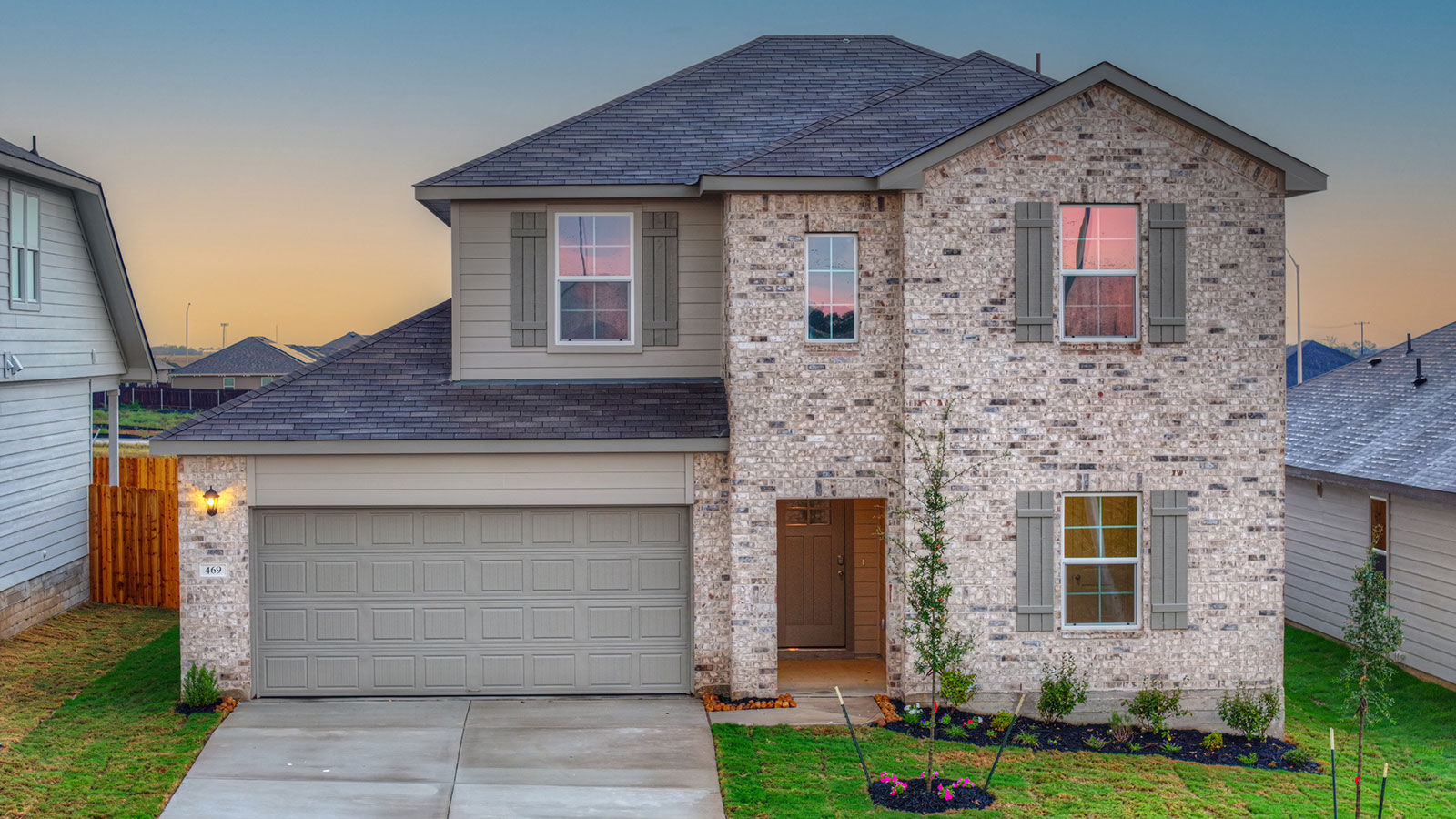 Two-story Naples with masonry exteriors and a 2 car garage.