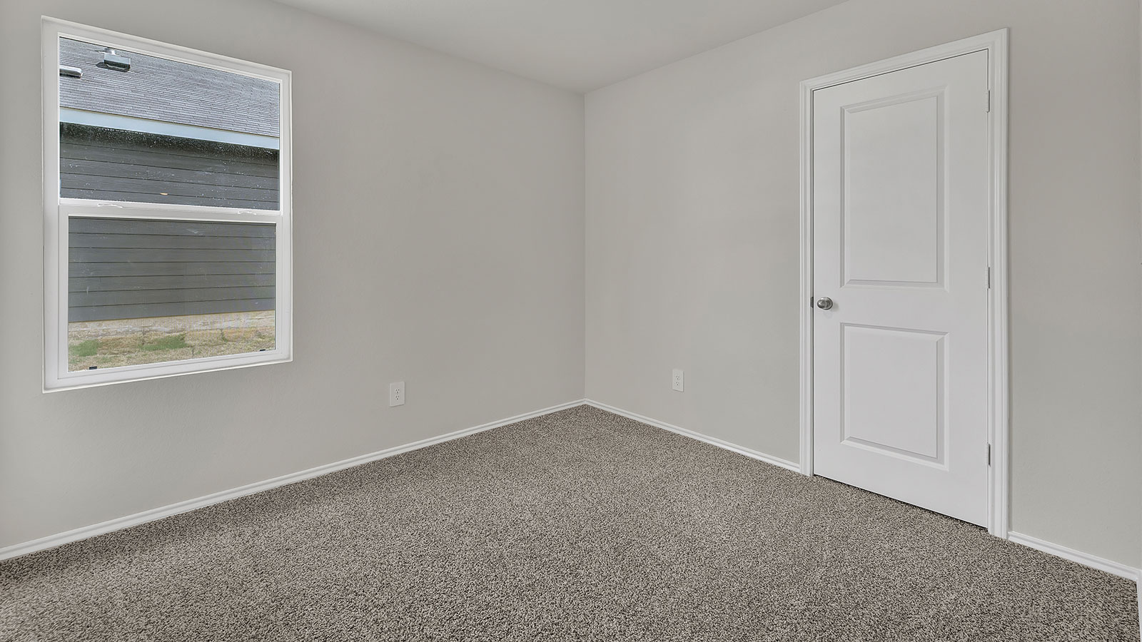 Hall bedroom with carpeting and closet.