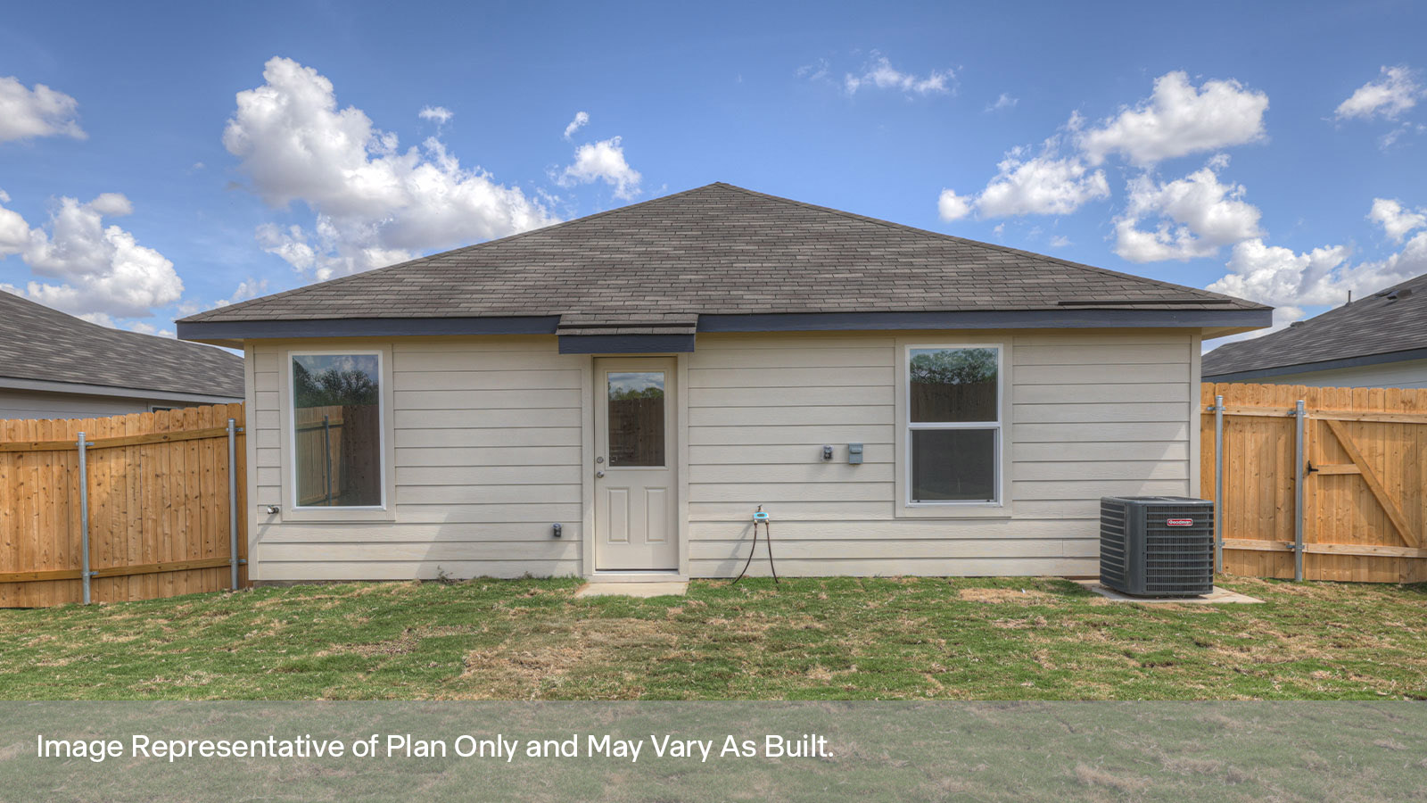 Backyard with sod and privacy fence.
