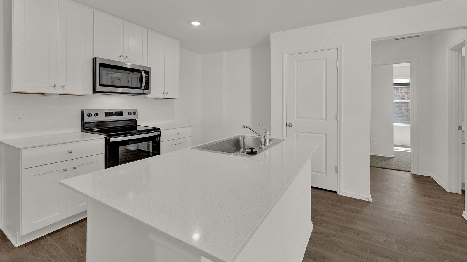 Kitchen with kitchen island and sink.