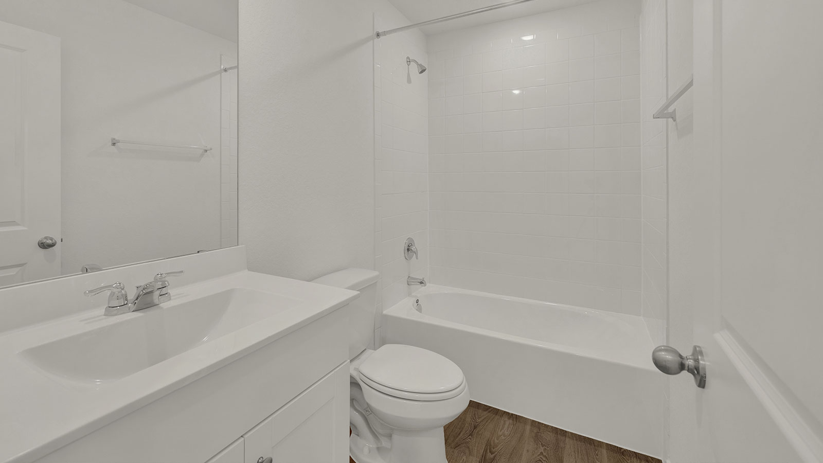 hall bath with vanity, toilet and shower tub combo