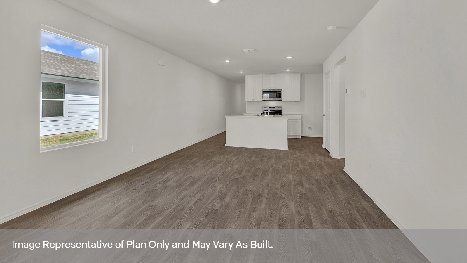 Dining room opening to the kitchen with kitchen island.