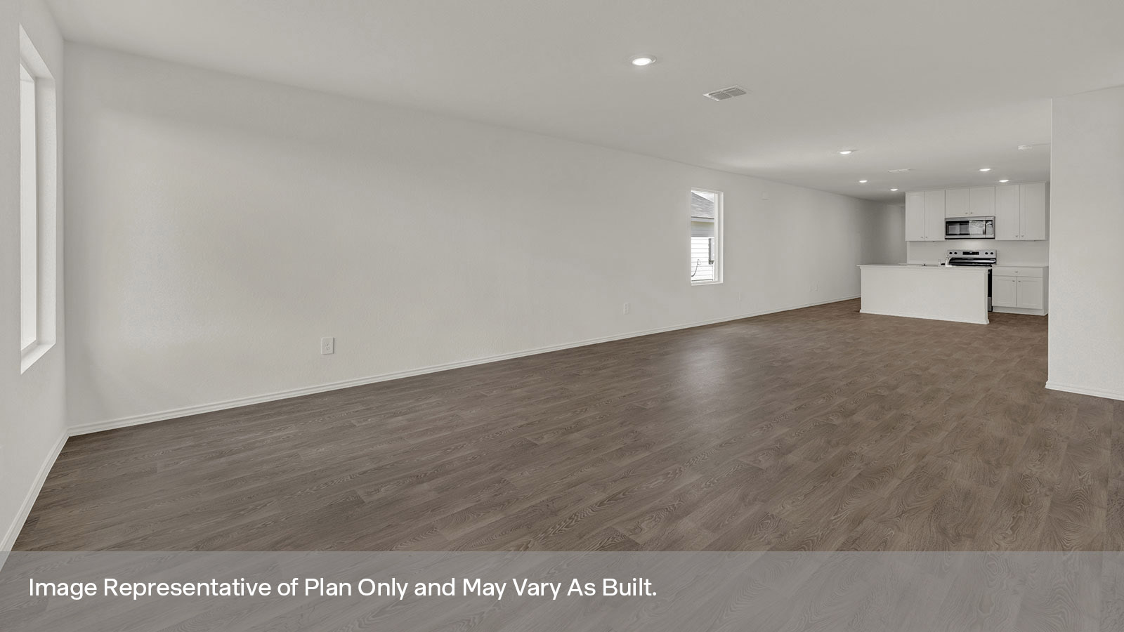 Living room with vinyl flooring, 2 windows, and  half lite exterior door.