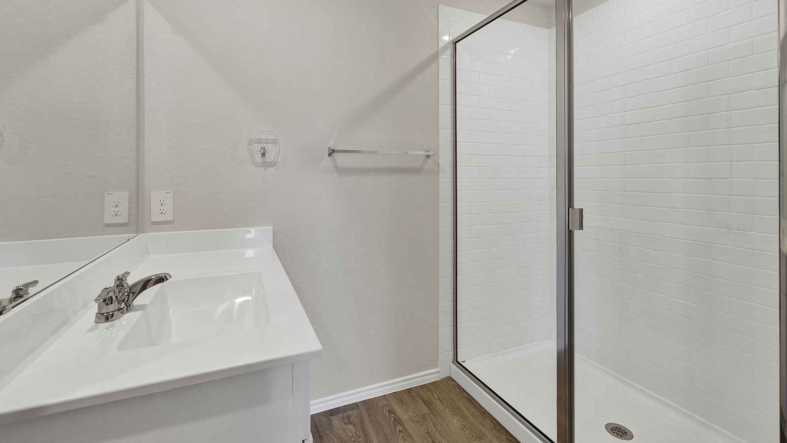 Main bathroom with single sink vanity and closet entry.