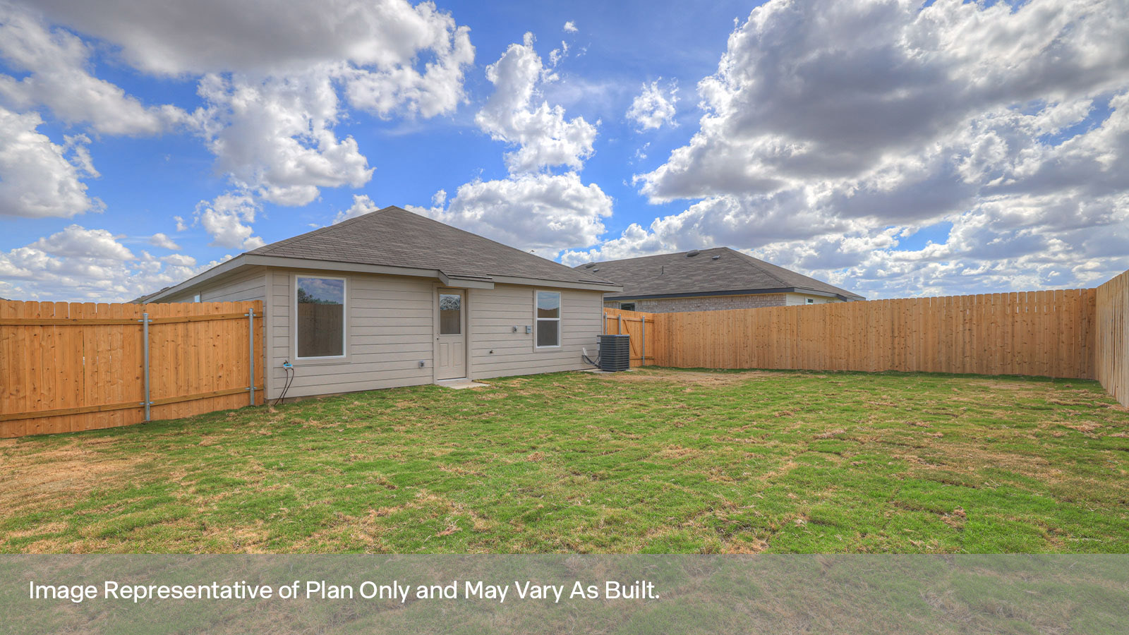 Backyard with sod and privacy fence.