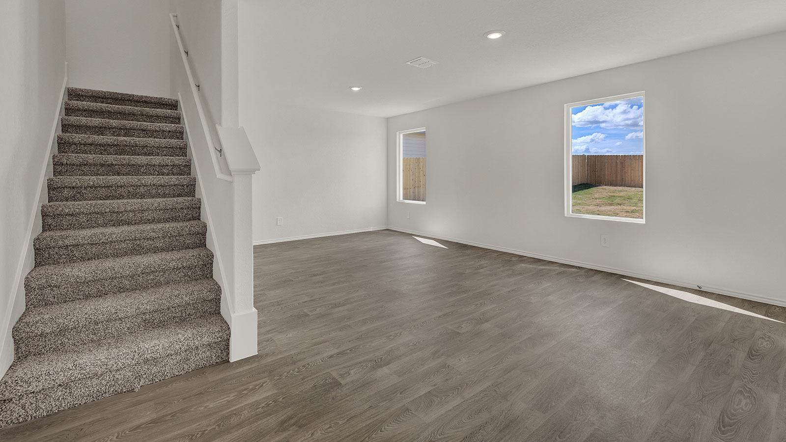 Living room with vinyl flooring.