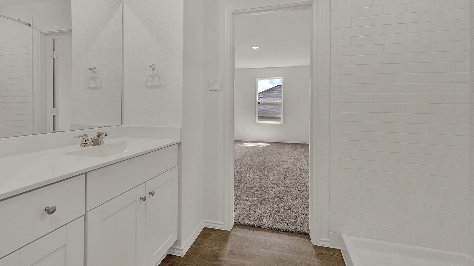 Main bathroom with single sink vanity.