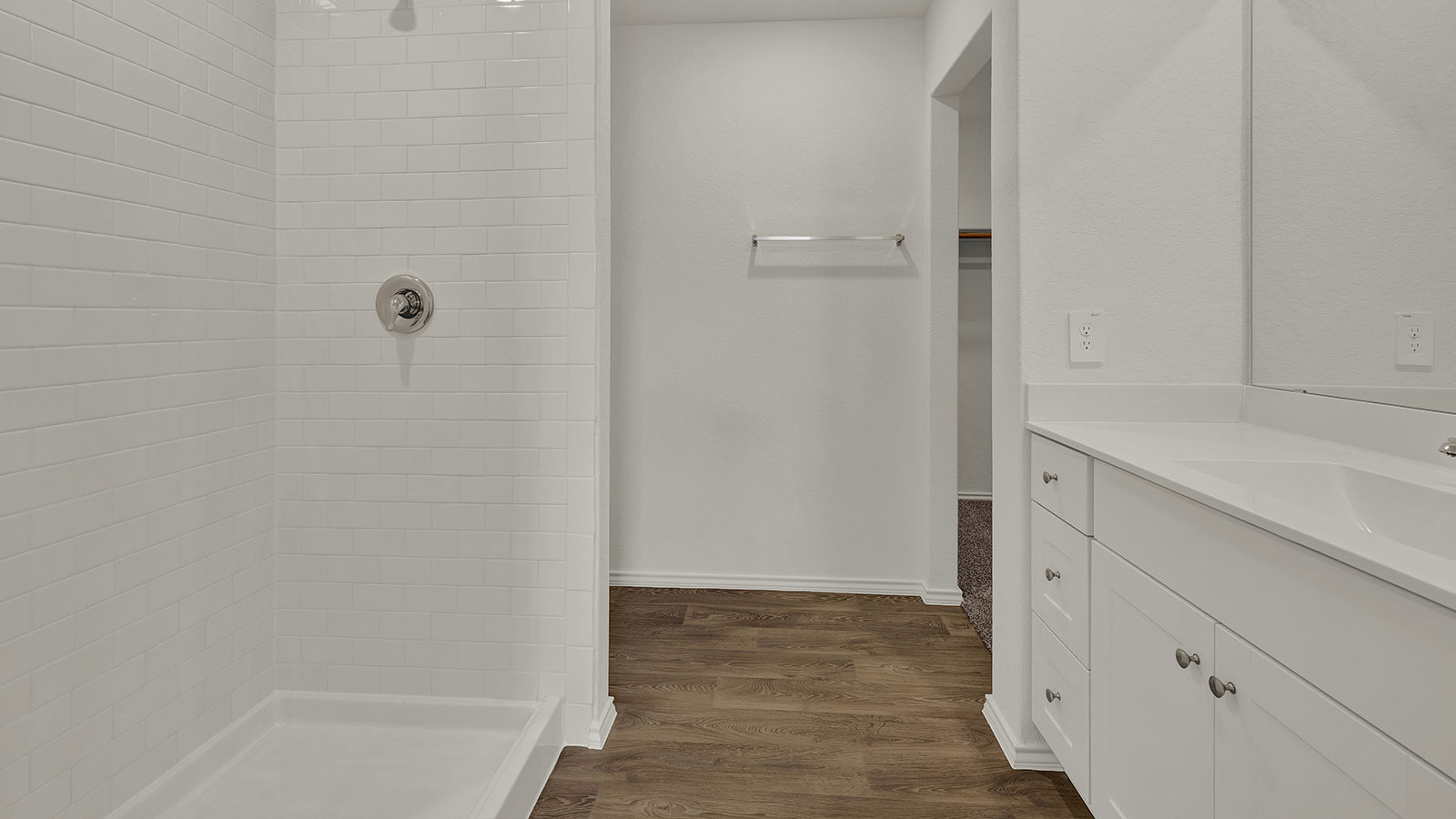 Main bathroom with single sink vanity.