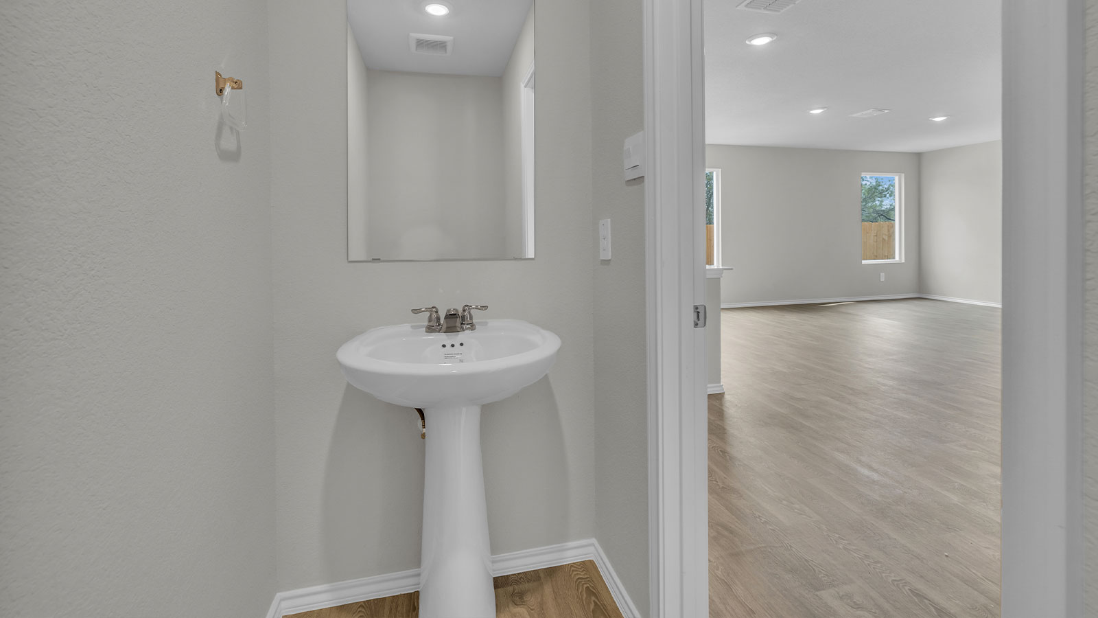Powder room with pedestal sink.