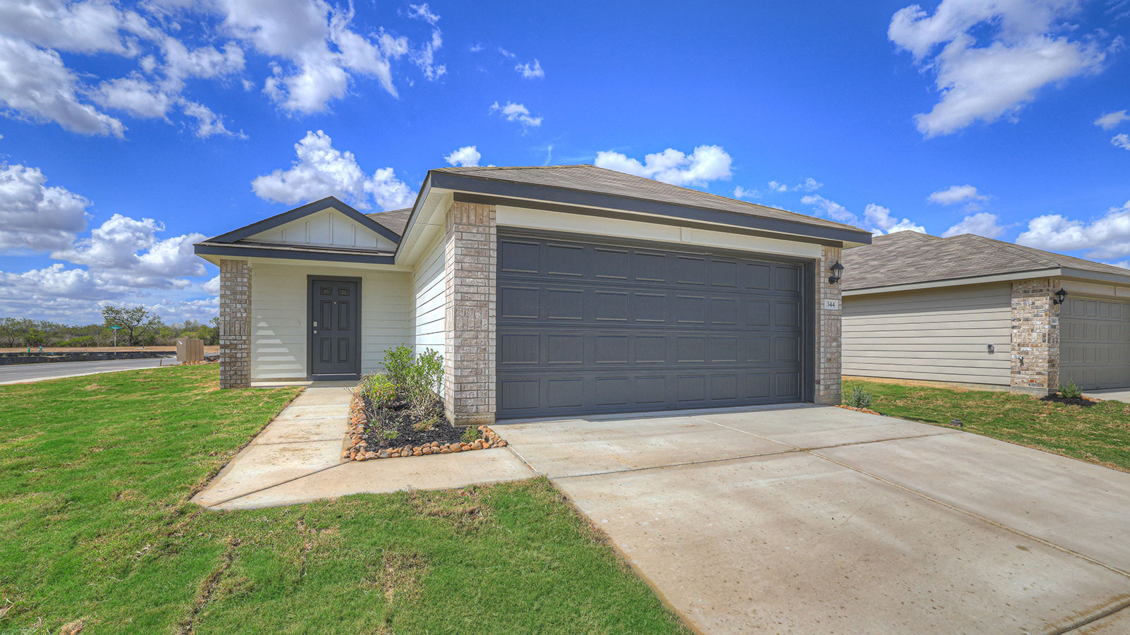 Single-story with traditional masonry exteriors.