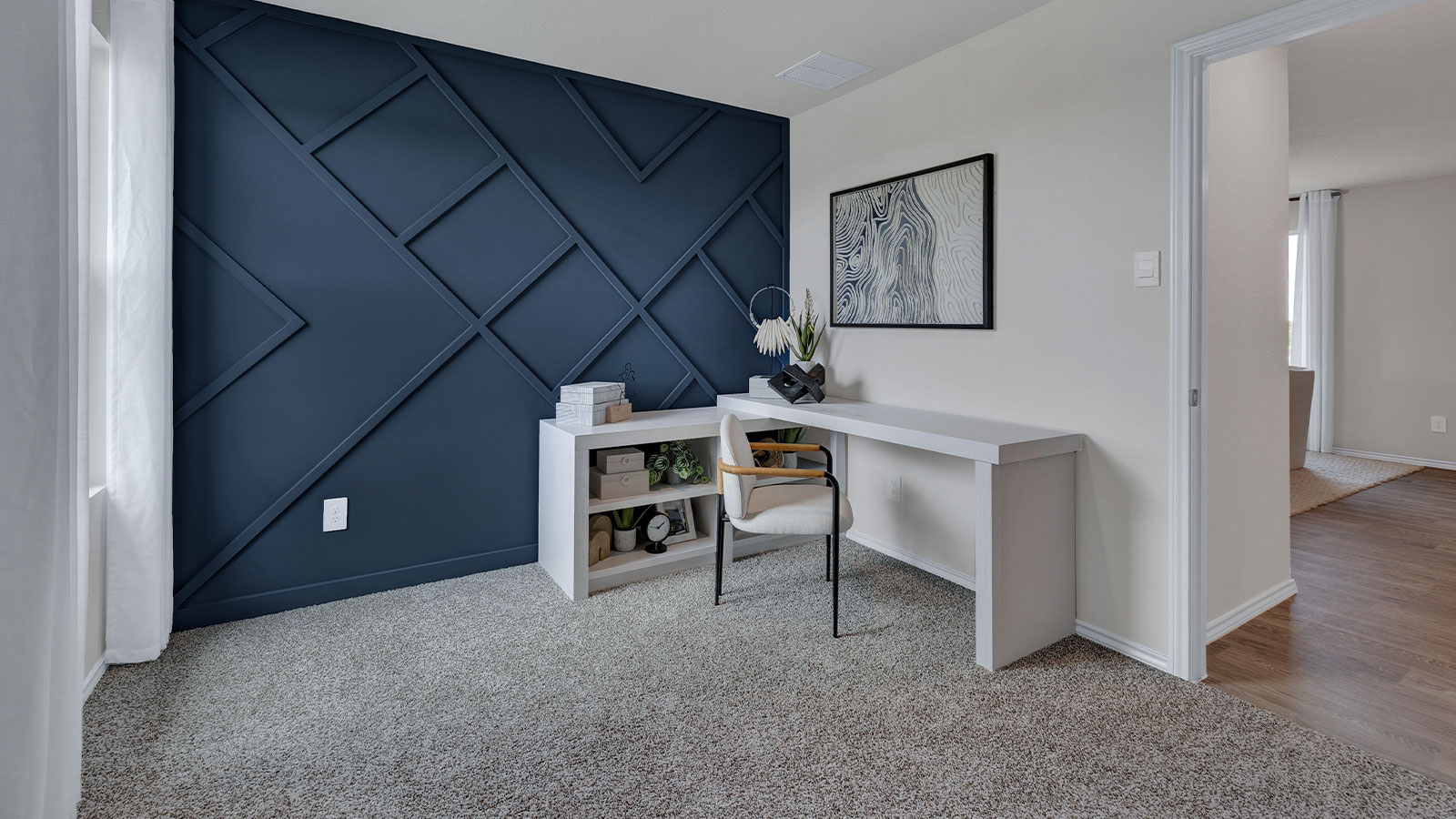 Bedroom with carpeting and one window.