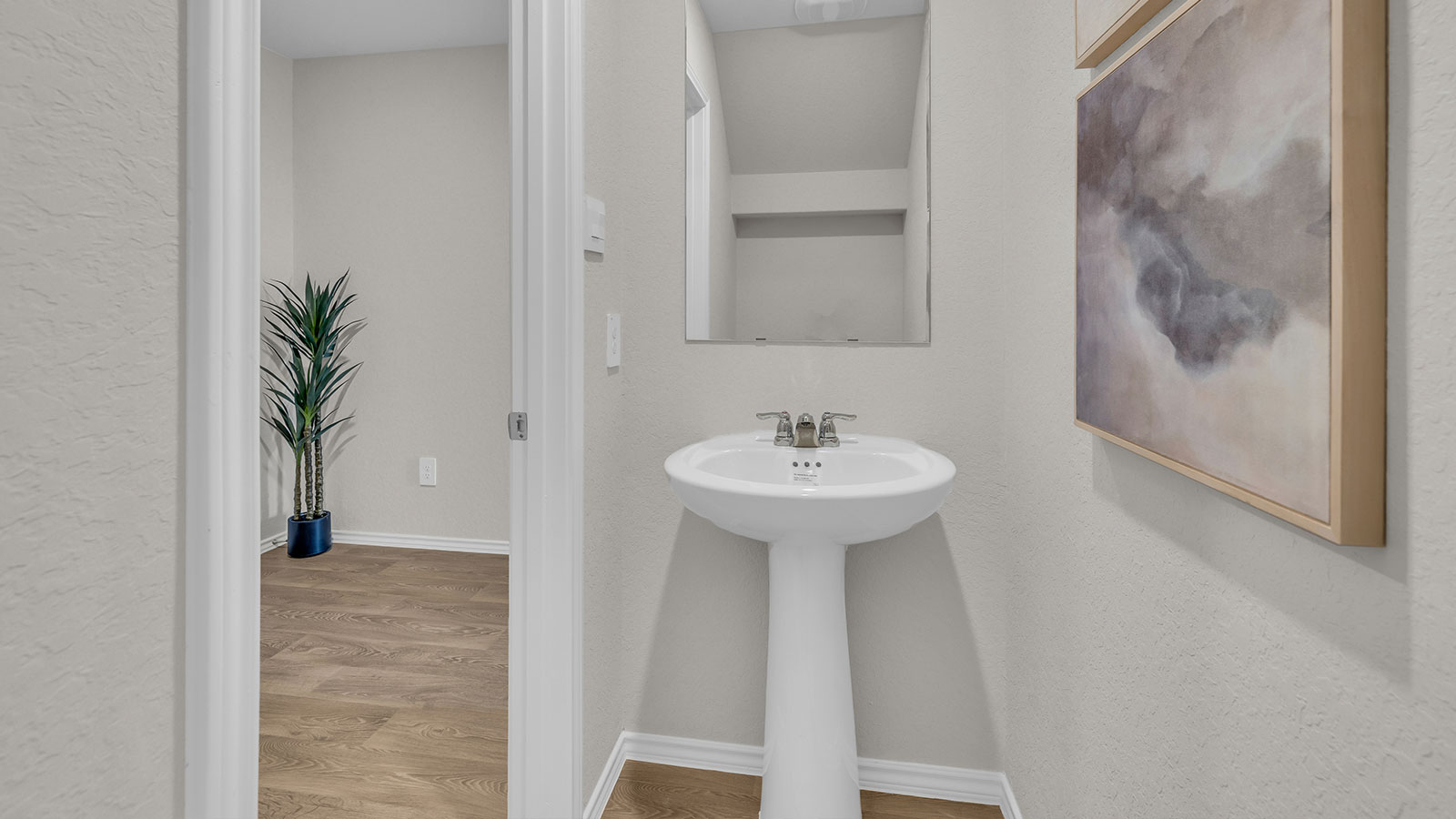 Powder room with a pedestal sink.