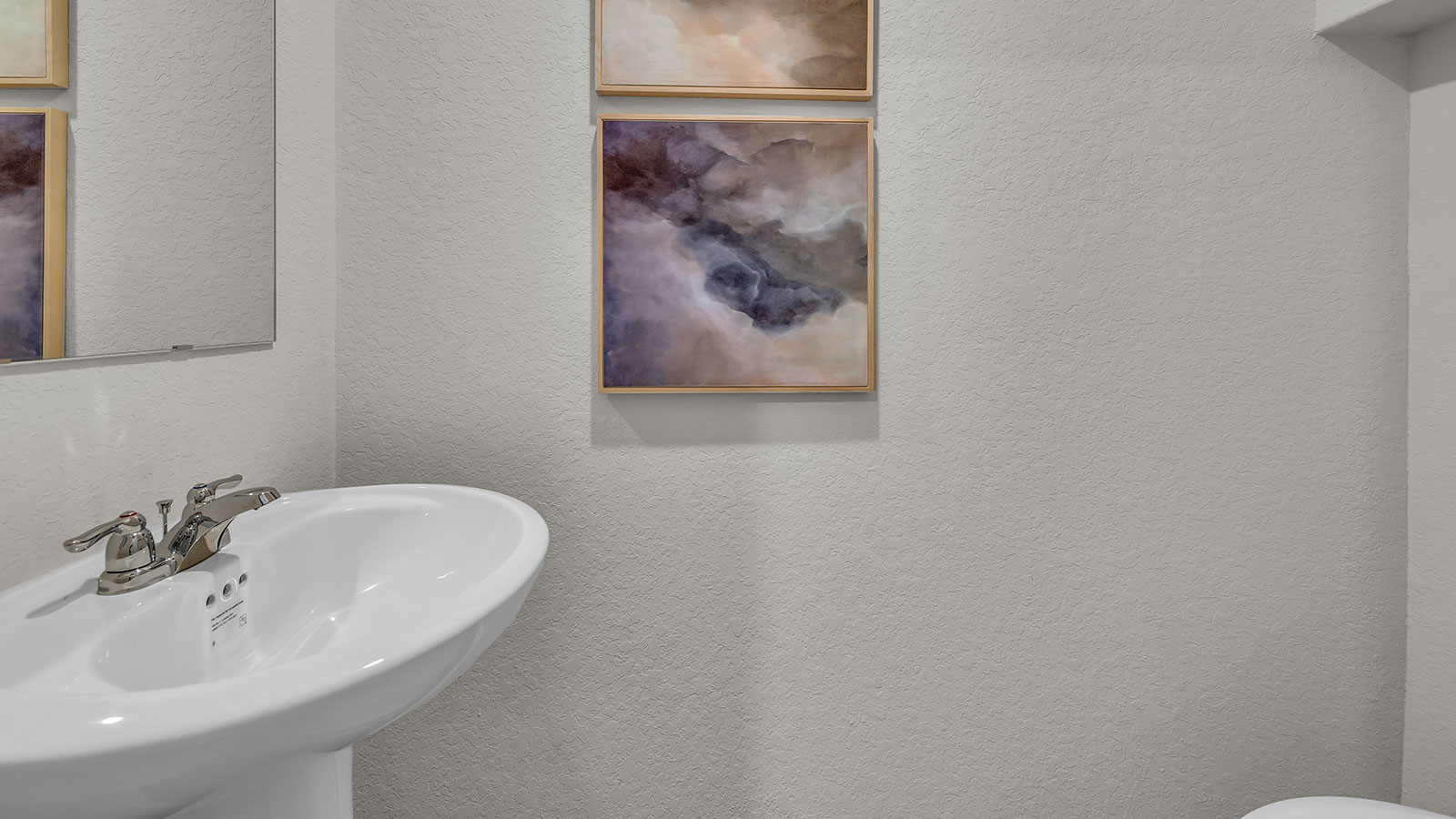 Powder room with a pedestal sink.