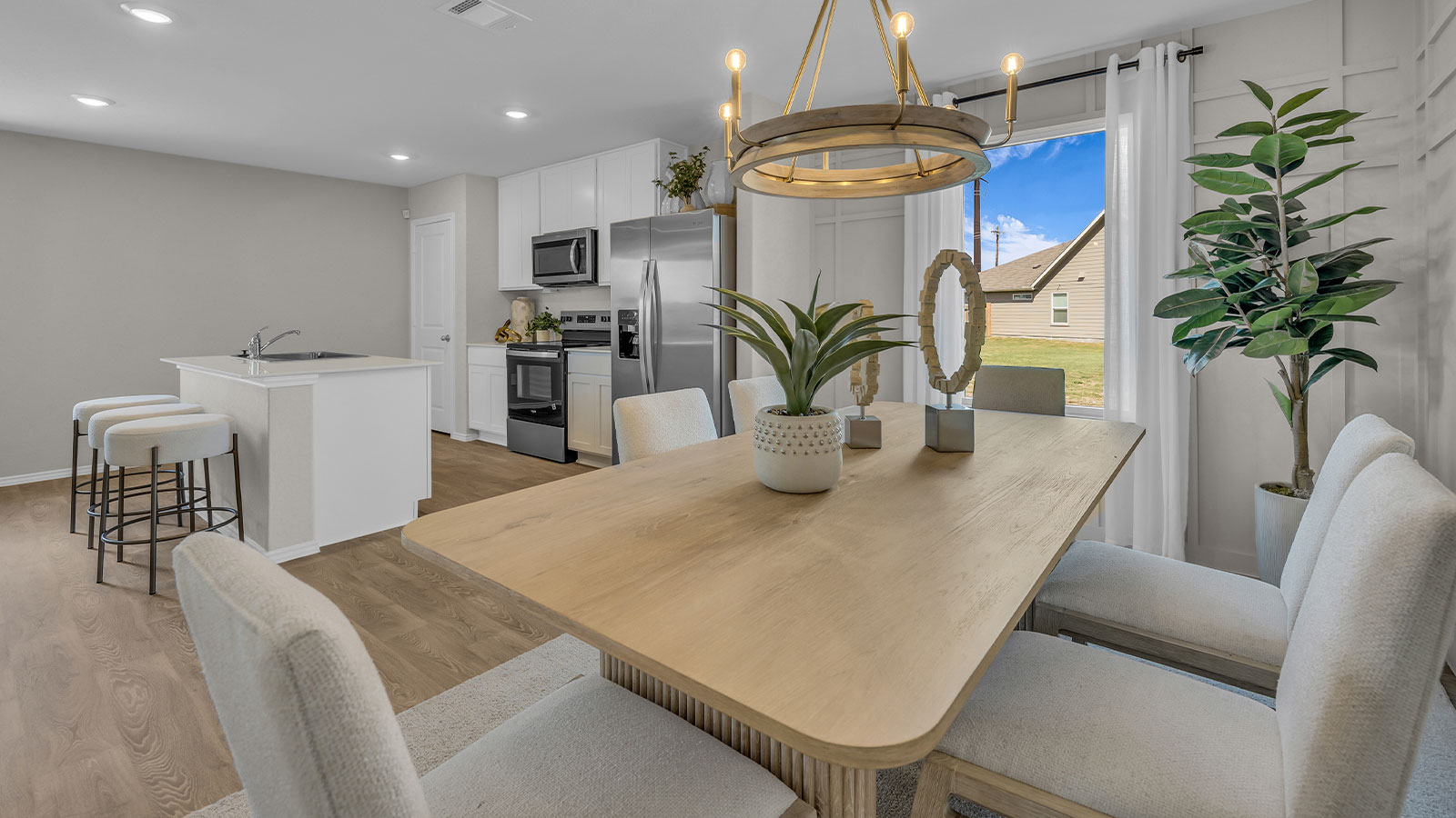 Dining room and living room with vinyl flooring and 1 window.