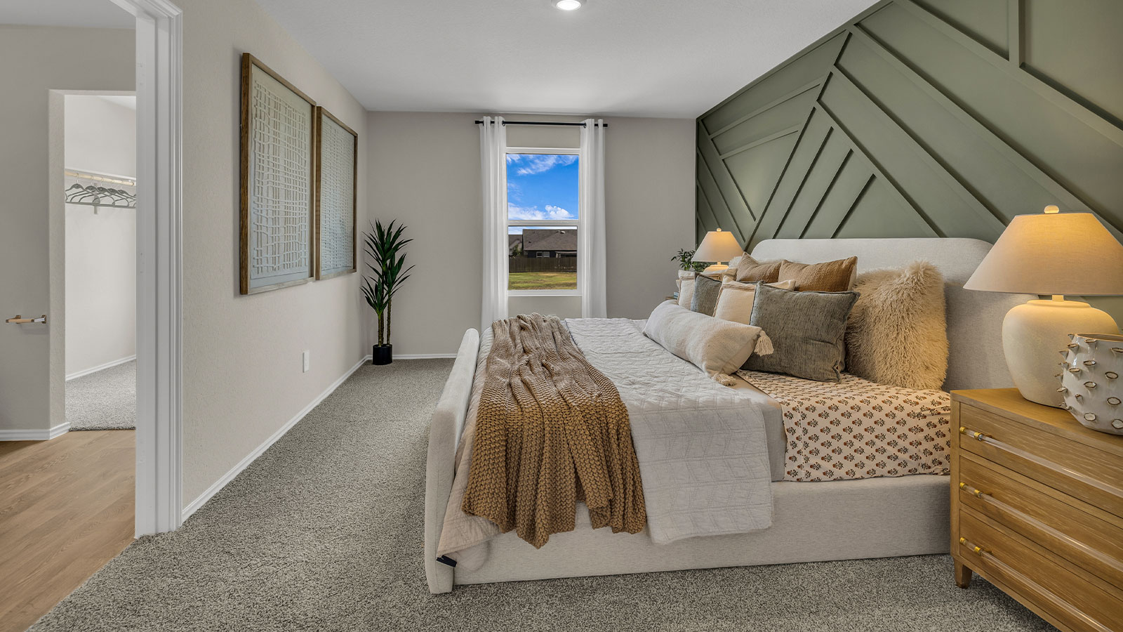 Main bedroom with carpeting and one window.