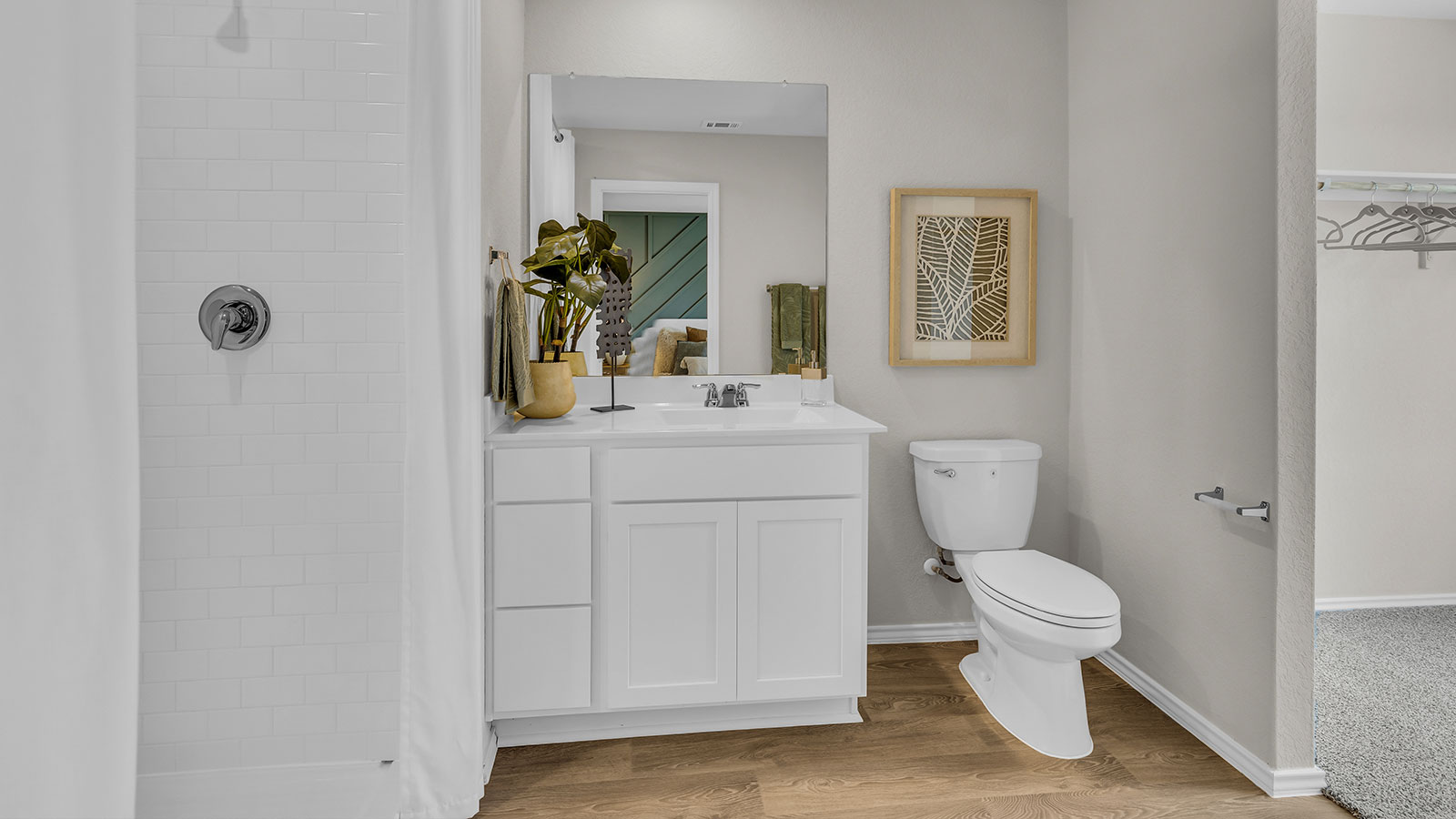 Main bathroom with sink, toilet, and shower.