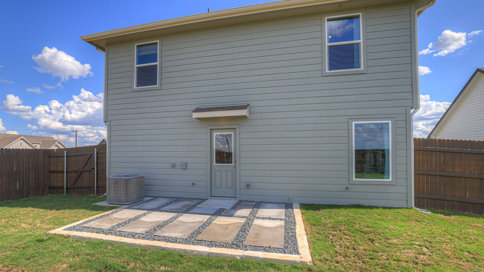 Backyard with sod and privacy fence.