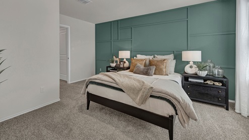 Main bedroom with carpeting with one window and entry to the bathroom and closet.