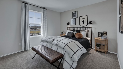 2nd bedroom with bed and window