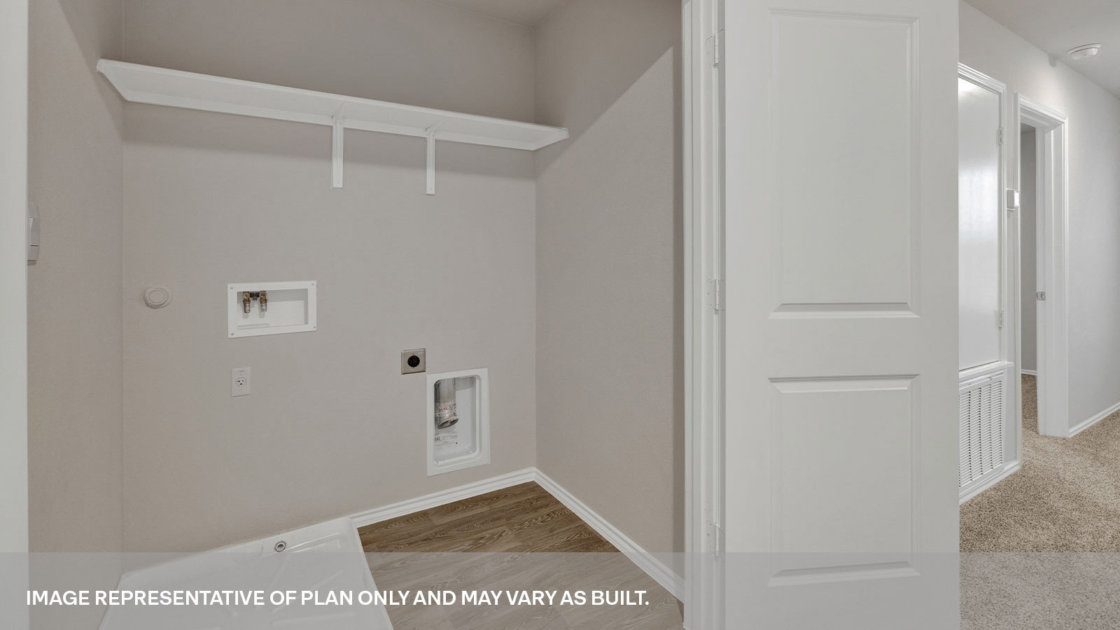 Laundry room with a wood shelf and washer/dryer connections.