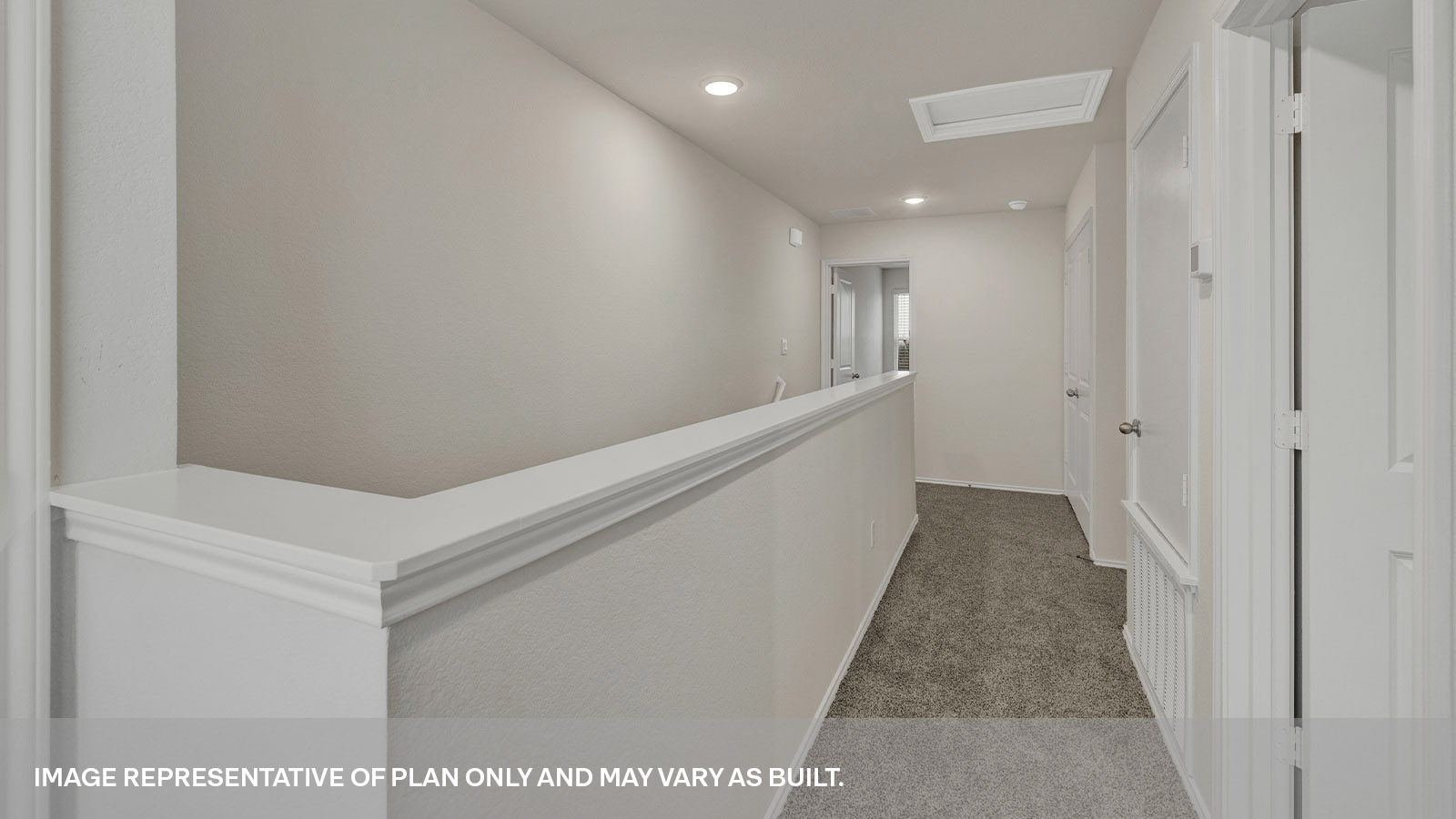 Second floor hallway leading to the staircase.